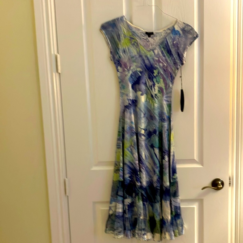 Komarov print dress with flared bottom.